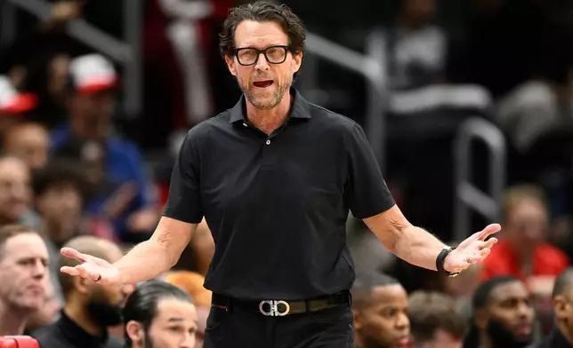 Atlanta Hawks head coach Quin Snyder gestures during the first half of an NBA basketball game against the Washington Wizards, Saturday, Dec. 6, 2025, in Washington. (AP Photo/Nick Wass)