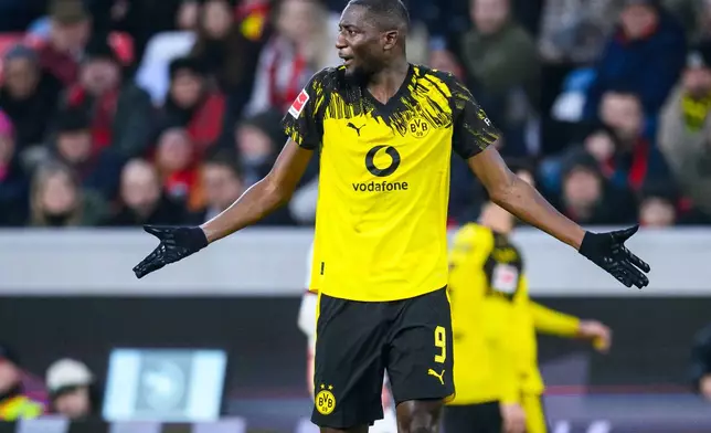 Dortmund's Serhou Guirassy reacts during the German Bundesliga soccer match between SC Freiburg and Borussia Dortmund in Freiburg, Germany, Sunday, Dec. 14, 2025. (Tom Weller/dpa via AP)