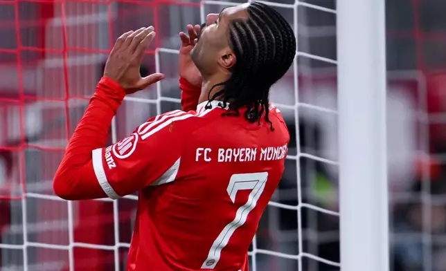 Munich's Serge Gnabry reacts during the German Bundesliga soccer match between FC Bayern Munich and FSV Mainz 05 in Munich, Germany, Sunday, Dec. 14, 2025. (Sven Hoppe/dpa via AP)