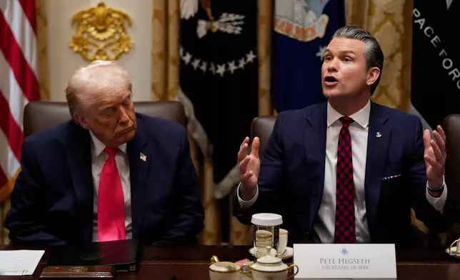 President Donald Trump closes his eyes as Defense Secretary Pete Hegseth speaks during a Cabinet meeting at the White House, Tuesday, Dec. 2, 2025, in Washington. (AP Photo/Julia Demaree Nikhinson)