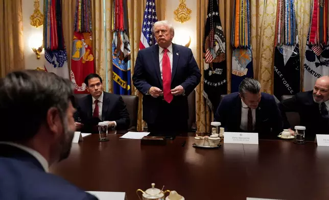 President Donald Trump stands up to depart following a Cabinet meeting at the White House, Tuesday, Dec. 2, 2025, in Washington. (AP Photo/Julia Demaree Nikhinson)