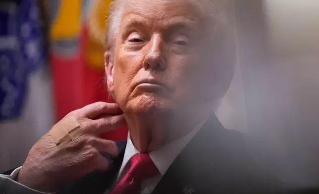 President Donald Trump listens during a Cabinet meeting at the White House, Tuesday, Dec. 2, 2025, in Washington. (AP Photo/Julia Demaree Nikhinson)