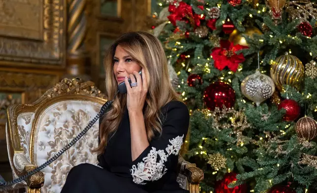 First lady Melania Trump speaks during a NORAD, North American Aerospace Defense Command, Tracks Santa Operation call at her Mar-a-Lago club, Wednesday, Dec. 24, 2025, in Palm Beach, Fla. (AP Photo/Alex Brandon)