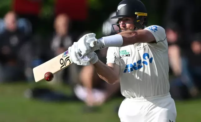 New Zealand's Nathan Smith bats against the West Indies during their cricket test match in Christchurch, New Zealand, Tuesday, Dec. 2, 2025. (Andrew Cornaga/Photosport via AP)
