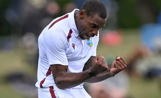 West Indies' Justin Greaves celebrates taking the wicket of New Zealand's Kane Williamson during their cricket test match in Christchurch, New Zealand, Tuesday, Dec. 2, 2025. (John Davidson/Photosport via AP)