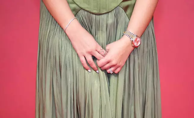 An actress poses for a photo on the red carpet during the 22nd Marrakech Film Festival, in Morocco, Wednesday, Dec. 3, 2025. (AP Photo/Mosa'ab Elshamy)