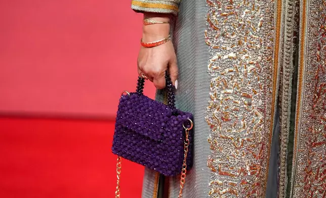 An actress poses for a photo on the red carpet during the 22nd Marrakech Film Festival, in Morocco, Tuesday, Dec. 2, 2025. (AP Photo/Mosa'ab Elshamy)