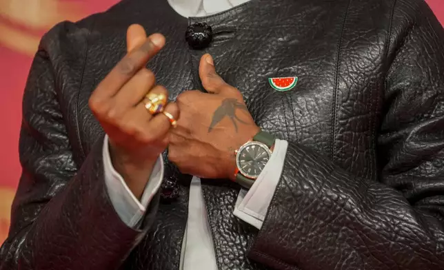 British filmmaker Akinola Davies Jr. gestures while wearing a pro-Palestinian pin during the 22nd Marrakech Film Festival, in Morocco, Wednesday, Dec. 3, 2025. (AP Photo/Mosa'ab Elshamy)