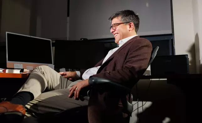 Juan Espinoza, vice provost for enrollment management at Virginia Tech, poses for a photo in his office, Nov. 12, 2025, in Blacksburg, Va. (AP Photo/Shaban Athuman)