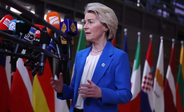 European Commission President Ursula von der Leyen speaks with the media as she arrives for the EU Summit in Brussels, Thursday, Dec. 18, 2025. (AP Photo/Omar Havana)