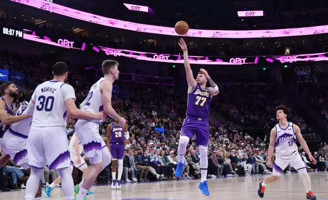 Los Angeles Lakers guard Luka Doncic (77) shoots against the Utah Jazz during the first half of an NBA basketball game, Thursday, Dec. 18, 2025, in Salt Lake City. (AP Photo/Rob Gray)