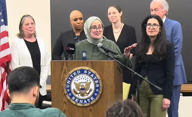 FILE - Tufts University student from Turkey, Rumeysa Ozturk, who was arrested by immigration agents while walking along a street in a Boston suburb, talks to reporters on arriving back in Boston, May 10, 2025, a day after she was released from a Louisiana immigration detention center on the orders of a federal judge. (AP Photo/Rodrique Ngowi, File)