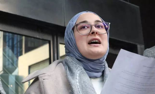 Tufts University doctoral student Rumeysa Ozturk reads from a prepared statement following a court hearing outside the John Joseph Moakley United States Courthouse Thursday, Dec. 4, 2025, in Boston. (AP Photo/Leah Willingham)