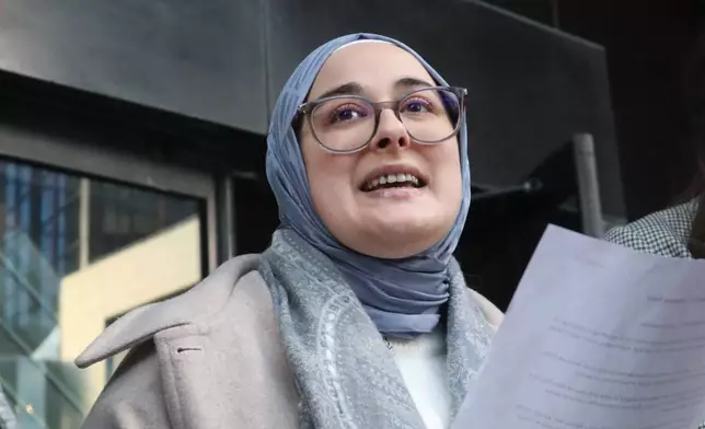 Tufts University doctoral student Rumeysa Ozturk reads from a prepared statement following a court hearing outside the John Joseph Moakley United States Courthouse Thursday, Dec. 4, 2025, in Boston. (AP Photo/Leah Willingham)