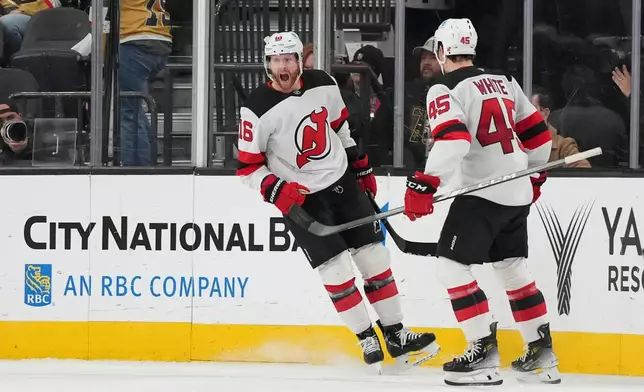 New Jersey Devils right wing Connor Brown (16) celebrates his goal against the Vegas Golden Knights during the second period of an NHL hockey game Wednesday, Dec. 17, 2025, in Las Vegas. (AP Photo/Candice Ward)