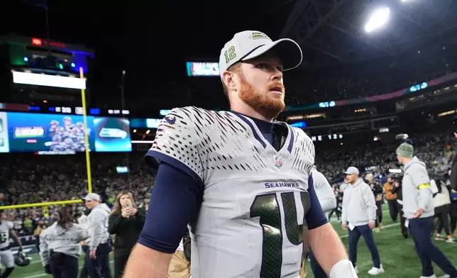 Seattle Seahawks quarterback Sam Darnold (14) walks on the field after an NFL football game against the Los Angeles Rams, Thursday, Dec. 18, 2025, in Seattle. (AP Photo/Lindsey Wasson)