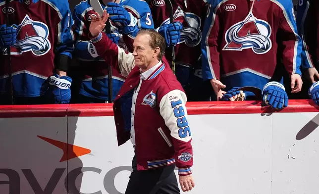 Colorado Avalanche general manager Joe Sakic and member of team that won the Stanley Cup in 1996, is introduced during a ceremony to mark the 30th anniversary of the win before an NHL hockey game against the Florida Panthers, Thursday, Dec. 11, 2025, in Denver. (AP Photo/David Zalubowski)