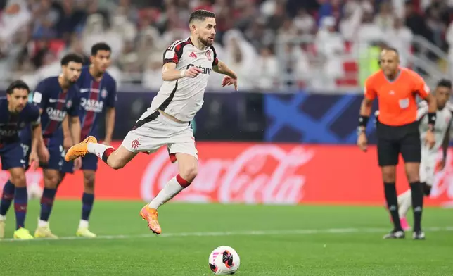 Flamengo's Jorginho scores his side's opening goal during the FIFA Intercontinental Cup final soccer match between Flamengo and Paris Saint-Germain in Doha, Qatar, Wednesday, Dec. 17, 2025. (AP Photo/Hussein Sayed)