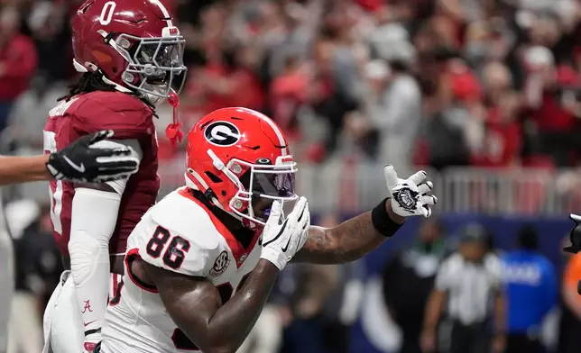 Georgia wide receiver Dillon Bell (86) celebrates his touchdown against Alabama during the first half of a Southeastern Conference championship NCAA college football game, Saturday, Dec. 6, 2025, in Atlanta. (AP Photo/Mike Stewart)