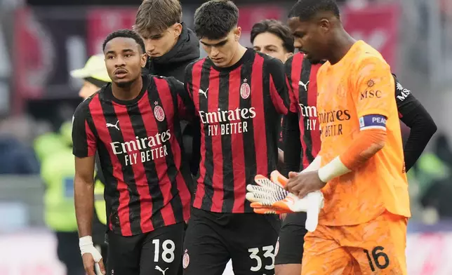 AC Milan players leave the field after the Serie A soccer match between AC Milan and Sassuolo, in Milan, Italy, Sunday, Dec. 14, 2025. (AP Photo/Luca Bruno)