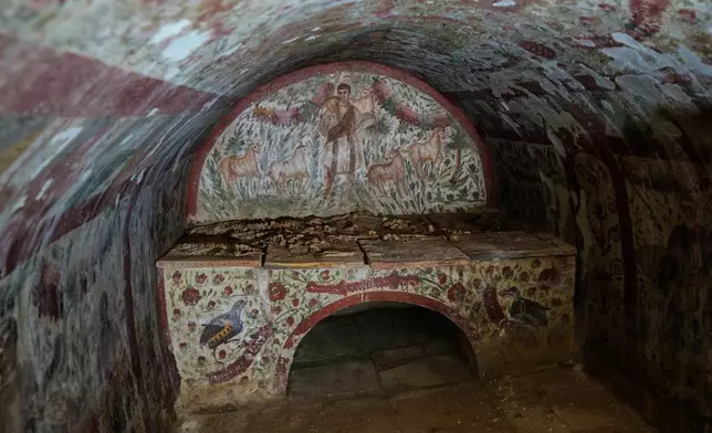 A fresco depicting Jesus as the "Good Shepherd" adorns the wall of a 3rd-century tomb in Hisardere, where archaeologists uncovered one of Anatolia's best-preserved early Christian artworks, in Iznik, Turkey, Friday, Dec. 12, 2025. (AP Photo/Khalil Hamra)
