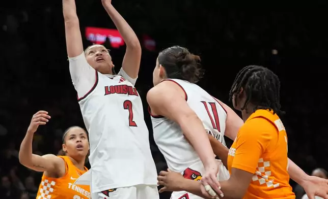 Louisville's Imari Berry (2) shoots over Tennessee's Deniya Prawl (25) during the second half of an NCAA college basketball game Saturday, Dec. 20, 2025, in New York. (AP Photo/Frank Franklin II)