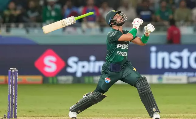 Pakistan's Sahibzada Farhan looses grip on his bat while playing a shot during the Asia Cup cricket match between India and Pakistan at Dubai International Cricket Stadium in Dubai, United Arab Emirates, Sept. 21, 2025. (AP Photo/Altaf Qadri, File)