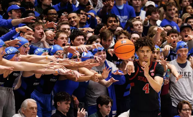Cameron Crazies student section try to distract Stanford's Oziyah Sellers's as he in-bounds the ball during the second half of an NCAA college basketball game against Duke in Durham, N.C., Feb. 15, 2025. (AP Photo/Ben McKeown, File)