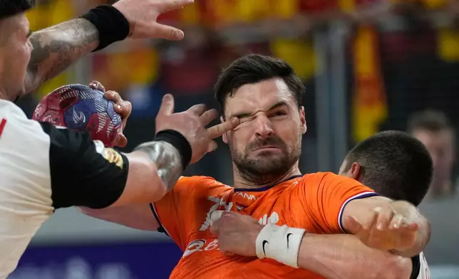 Dani Baijens, of the Netherlands, center, tries to score during the second round, group D, handball match between The Netherlands and North Macedonia at the Handball Men's World Championship in Varazdin, Croatia, Jan. 17, 2025. (AP Photo/Darko Bandic, File)