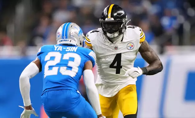Pittsburgh Steelers' DK Metcalf, right, plays against Detroit Lions' Rock Ya-Sin during the second half of an NFL football game, Sunday, Dec. 21, 2025, in Detroit. (AP Photo/Ryan Sun)