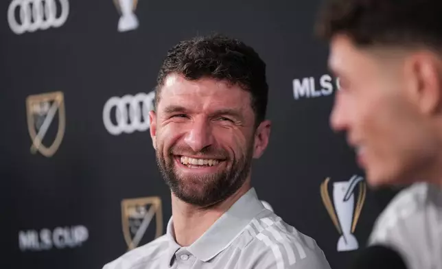 Vancouver Whitecaps' Thomas Muller laughs during news conference Thursday, Dec. 4, 2025, in Fort Lauderdale, Fla., ahead of Saturday's of the MLS Cup soccer match against Inter Miami. (Darryl Dyck/The Canadian Press via