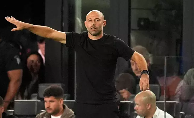 Inter Miami head coach Javier Mascherano gestures to his players from the sideline during the first half of an MLS Eastern Conference final soccer match against New York City FC, Saturday, Nov. 29, 2025, in Fort Lauderdale, Fla. (AP Photo/Rebecca Blackwell)