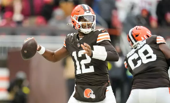 Cleveland Browns quarterback Shedeur Sanders (12) passes against the San Francisco 49ers during the second half of an NFL football game, Sunday, Nov. 30, 2025, in Cleveland. (AP Photo/Sue Ogrocki)