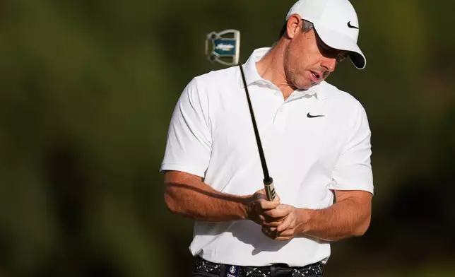 Rory McIlroy. of Northern Ireland, reacts after putting on the the 11th hole during the first round of the Australian Open golf tournament in Melbourne, Australia, Thursday, Dec. 4, 2025. (AP Photo/Asanka Brendon Ratnayake)