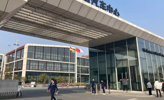 People pass by the entrance to Volkswagen (China) Technology Company, a 3 billion euros ($3.5 billion) R&amp;D center in Hefei in eastern China's Anhui province, on Feb. 25, 2025. (AP Photo/Ken Moritsugu)