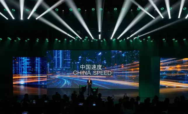 Ralf Brandstatter, Chairman and CEO of Volkswagen Group China, speaks near the slogan "China Speed" during the Volkswagen Group media night ahead of the Auto Show in Shanghai, April 22, 2025. (AP Photo/Ng Han Guan)