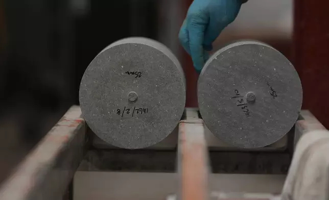 Blue Hone granite blocks are prepared to be used as part of a curling stone at Kays Curling stone factory in Mauchline, Scotland, Tuesday, Nov. 11, 2025. (AP Photo/Alastair Grant)