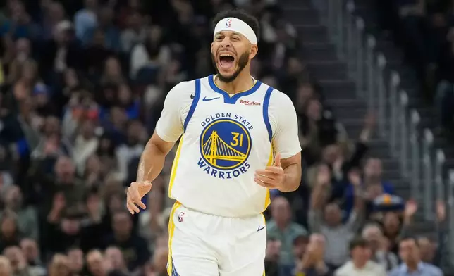 Golden State Warriors guard Seth Curry (31) reacts after scoring against the Oklahoma City Thunder during the first half of an NBA basketball game in San Francisco, Tuesday, Dec. 2, 2025. (AP Photo/Jeff Chiu)