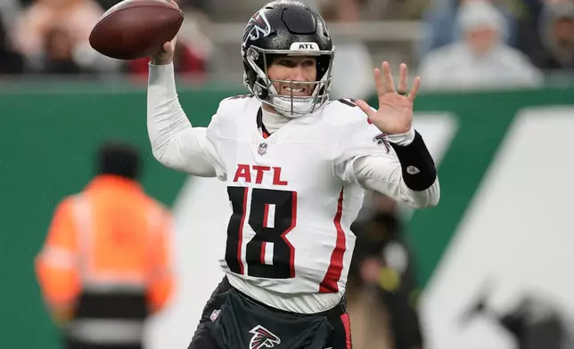 Atlanta Falcons quarterback Kirk Cousins (18) passes against the New York Jets during the first half of an NFL football game, Sunday, Nov. 30, 2025, in East Rutherford, N.J. (AP Photo/Adam Hunger)