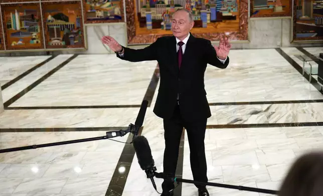 Russian President Vladimir Putin gestures speaking to journalists after the plenary session of the VTB "Russia Calling" Investment forum in Moscow, Tuesday, Dec. 2, 2025. (Sergei Ilnitsky/Pool Photo via AP)