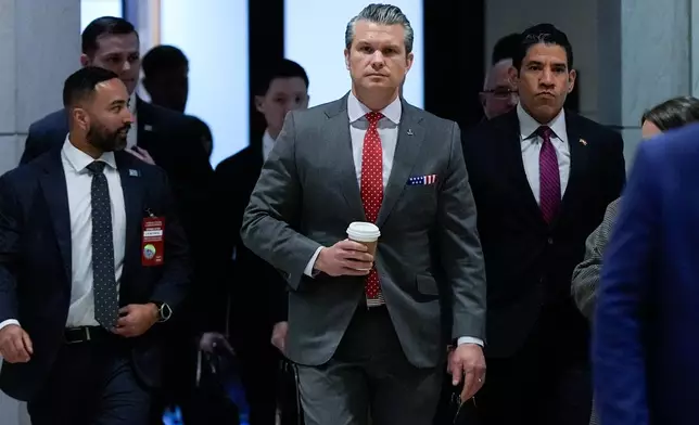Defense Secretary Pete Hegseth arrives to brief members of Congress on military strikes near Venezuela, Tuesday, Dec. 16, 2025, at the Capitol in Washington. (AP Photo/Julia Demaree Nikhinson)