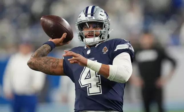 Dallas Cowboys quarterback Dak Prescott works out prior to an NFL football game against the Detroit Lions Thursday, Dec. 4, 2025, in Detroit. (AP Photo/Paul Sancya)
