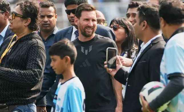 Argentine soccer star Lionel Messi, center, arrives at the Salt Lake Stadium, in Kolkata, India, Saturday, Dec. 13, 2025. (AP Photo/Bikas Das)