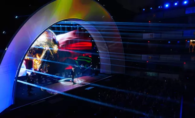 Singer Andrea Bocelli performs at the draw for the 2026 soccer World Cup at the Kennedy Center in Washington, Friday, Dec. 5, 2025. (AP Photo/Evan Vucci)
