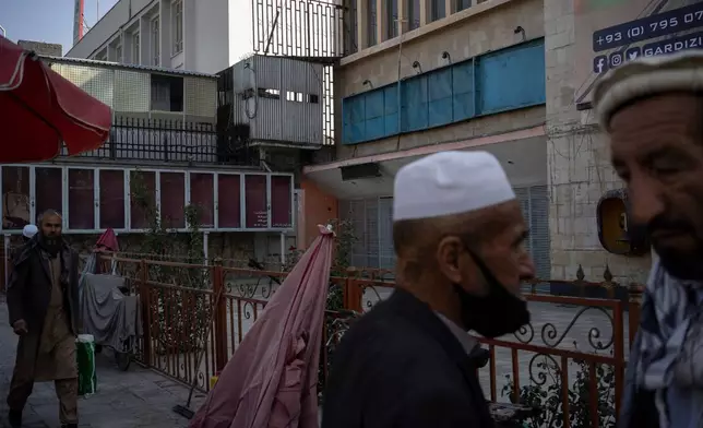 FILE - Empty billboards that used to display posters of Bollywood movies and American action flicks hang outside the Ariana Cinema in Kabul, Afghanistan, Monday, Nov. 8, 2021, before the cinema was demolished in December 2025 by Taliban authorities to make way for a new shopping center. (AP Photo/Bram Janssen, File)