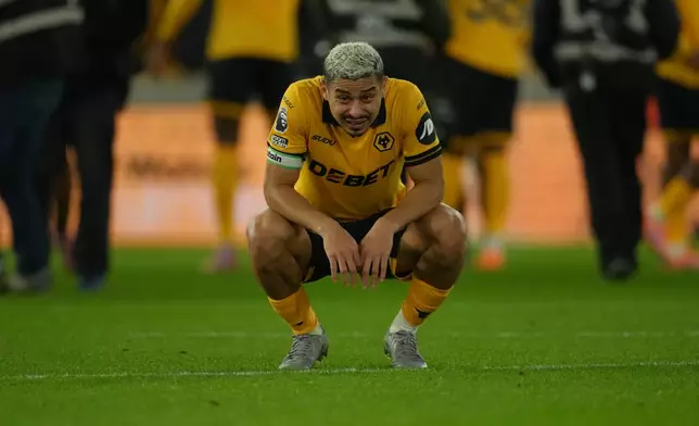 Wolverhampton Wanderers' Andre reacts after the Premier League soccer match between Wolverhampton Wandere and Manchester United in Wolverhampton, England Monday, Dec. 8, 2025. (AP Photo/Dave Shopland)