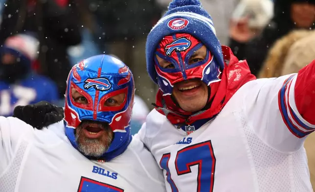 Fans call out before an NFL football game between the Buffalo Bills and the Cincinnati Bengals, Sunday, Dec. 7, 2025, in Orchard Park, N.Y. (AP Photo/Jeffrey T. Barnes)