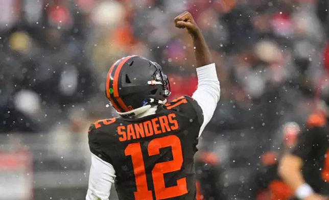 Cleveland Browns quarterback Shedeur Sanders celebrates after throwing a touchdown pass in the first half of an NFL football game against the Tennessee Titans in Cleveland, Sunday, Dec. 7, 2025. (AP Photo/David Richard)