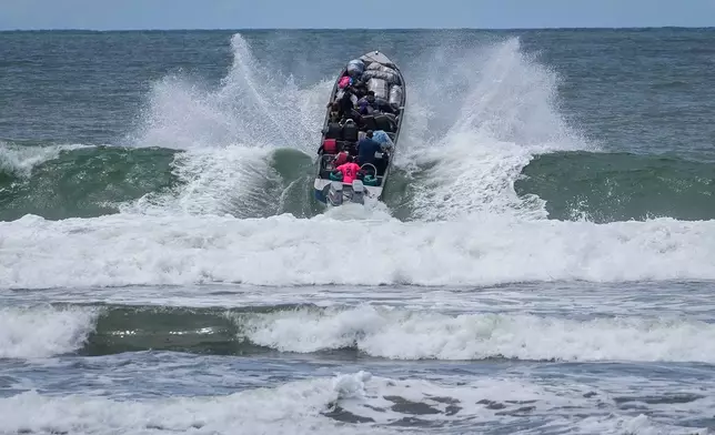 FILE - Venezuelan migrants depart Jaque on Panama's Pacific coast en route to Jurado, Colombia, as they return home after failing to enter the United States, Sept. 19, 2025. (AP Photo/Matias Delacroix, File)