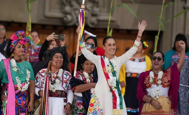FILE - President Claudia Sheinbaum waves to supporters in the Zócalo, Mexico City's main square, on the day of her inauguration, Oct. 1, 2024. (AP Photo/Fernando Llano, File)